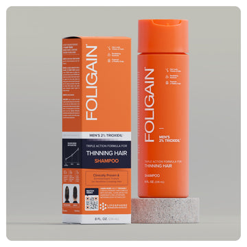 FOLIGAIN men’s Triple Action Shampoo with 2% TRIOXIDIL, orange bottle and box.