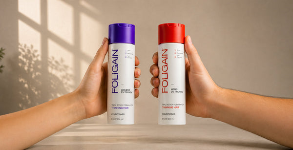 Hands holding FOLIGAIN men’s and women’s conditioners with 2% TRIOXIDIL.